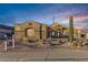 Stunning exterior view of the single story home featuring desert landscaping and a private driveway at 10040 E Grandview St, Mesa, AZ 85207
