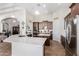 Gourmet kitchen with stainless steel appliances, white countertops, dark cabinetry, and a large island at 10040 E Grandview St, Mesa, AZ 85207