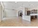 Open-concept living room with tile floors, neutral paint, and easy access to the kitchen at 10040 E Grandview St, Mesa, AZ 85207