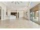 Spacious open-concept living room with tile floors and easy access to the kitchen and patio at 10040 E Grandview St, Mesa, AZ 85207
