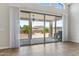 Bright living area with tiled floors and a large sliding glass doors leading to the backyard patio at 10040 E Grandview St, Mesa, AZ 85207