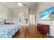 Spacious primary bedroom featuring wood floors, high ceilings and ensuite bathroom at 10040 E Grandview St, Mesa, AZ 85207