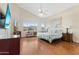 Bright and airy main bedroom with high ceilings, ceiling fan, large windows, and beautiful mountain views at 10040 E Grandview St, Mesa, AZ 85207