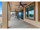 Covered patio offers a ceiling fan and an idyllic space for outdoor living and dining at 10040 E Grandview St, Mesa, AZ 85207