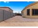 Gravel side yard with brick walls, an AC unit and direct outdoor access at 10040 E Grandview St, Mesa, AZ 85207
