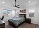 Comfortable bedroom with a neutral color palette, well-lit by natural light and ceiling fan, offering a serene retreat at 10714 E Lincoln Ave, Mesa, AZ 85212