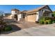 Charming single-Gathering home with a landscaped front yard and a two-car garage at 10714 E Lincoln Ave, Mesa, AZ 85212