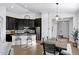 Modern kitchen featuring dark cabinets, granite countertops, and stainless steel appliances at 10714 E Lincoln Ave, Mesa, AZ 85212