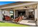 Inviting outdoor patio with comfortable seating and a view of the lush backyard at 10714 E Lincoln Ave, Mesa, AZ 85212