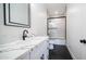 Modern bathroom with white cabinetry, sleek countertops, and glass enclosed shower for a relaxing and stylish experience at 10910 N Thunderbird Rd, Maricopa, AZ 85139