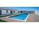 Sparkling blue pool with a water feature, turf and a private, fenced backyard at 10910 N Thunderbird Rd, Maricopa, AZ 85139