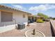The backyard has low maintenance landscaping and a covered patio area at 11059 E Kilarea Ave, Mesa, AZ 85209