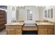 Bathroom featuring double sinks with granite countertops and a vanity at 11059 E Kilarea Ave, Mesa, AZ 85209