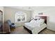 Bright bedroom has vaulted ceiling and a window with an arched transom at 11059 E Kilarea Ave, Mesa, AZ 85209