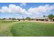 The home sits on a golf course with beautiful views at 11059 E Kilarea Ave, Mesa, AZ 85209