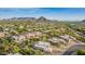 Expansive aerial view of a desert community with luxurious homes and stunning mountain backdrop on a clear day at 11123 E Monument Dr, Scottsdale, AZ 85262