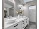 Bathroom vanity area shows double sinks and a decorative flower arrangement at 11123 E Monument Dr, Scottsdale, AZ 85262