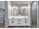 Bathroom shows a long vanity with double sinks, decorative lighting, and tile floors at 11123 E Monument Dr, Scottsdale, AZ 85262