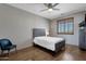 Cozy bedroom with wood floors, shuttered windows, and a comfortable bed, creating a serene retreat at 11123 E Monument Dr, Scottsdale, AZ 85262