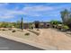 Contemporary home exterior with desert landscaping and a unique architectural design with inviting curb appeal at 11123 E Monument Dr, Scottsdale, AZ 85262