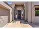 Inviting front entrance showcasing a stylish door, stone accents, and low-maintenance desert landscaping at 11123 E Monument Dr, Scottsdale, AZ 85262