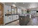 Bright kitchen with white cabinetry, a dark countertop, and views to the dining area at 11123 E Monument Dr, Scottsdale, AZ 85262