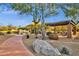 Community playground and picnic area shaded by mature trees and ramada at 11123 E Monument Dr, Scottsdale, AZ 85262