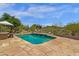 Beautiful in-ground pool with stone patio and desert plants that provides a backyard oasis perfect for relaxation and entertainment at 11123 E Monument Dr, Scottsdale, AZ 85262
