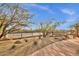 Community tennis court featuring desert landscaping and trees at 11123 E Monument Dr, Scottsdale, AZ 85262