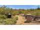 Desert hiking trail entrance with vegetation and signage for trail rules at 11123 E Monument Dr, Scottsdale, AZ 85262