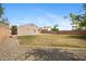 Large backyard with gravel area, block wall, and grass at 12443 W Via Camille --, El Mirage, AZ 85335