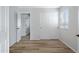 Empty bedroom with luxury vinyl plank flooring, and a closet with sliding doors at 12443 W Via Camille --, El Mirage, AZ 85335