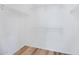 This closet features white walls, wood-look floors, and wire shelving at 12443 W Via Camille --, El Mirage, AZ 85335