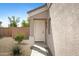 Neutral colored front door situated beside desert landscaping at 12443 W Via Camille --, El Mirage, AZ 85335