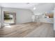 Bright and open living area featuring modern flooring and sliding glass doors to the backyard at 12443 W Via Camille --, El Mirage, AZ 85335