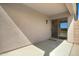 The covered patio features stucco walls and a sliding glass door to the home's interior at 12443 W Via Camille --, El Mirage, AZ 85335