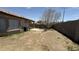 Backyard featuring desert landscaping and a covered patio area at 12505 W Adams St, Avondale, AZ 85323