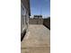View of a side yard featuring a compact area covered with gravel and a block wall at 12505 W Adams St, Avondale, AZ 85323
