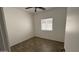 Bedroom with window bringing in natural light, featuring wood-look tile flooring at 12505 W Adams St, Avondale, AZ 85323