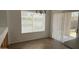 Cozy dining area with a chandelier, blinds, and tile flooring at 12505 W Adams St, Avondale, AZ 85323