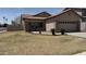Well-maintained home with a tile roof, desert landscaping, and a two-car garage at 12505 W Adams St, Avondale, AZ 85323