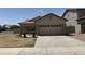 Charming single-story home featuring a tile roof and a spacious two-car garage at 12505 W Adams St, Avondale, AZ 85323