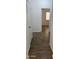 Hallway featuring neutral walls and wood-look tile flooring at 12505 W Adams St, Avondale, AZ 85323