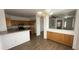 Eat-in kitchen featuring wood cabinets, light countertops, and stainless steel appliances at 12505 W Adams St, Avondale, AZ 85323