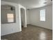 Bright living room featuring tile floors, white walls, and natural light at 12505 W Adams St, Avondale, AZ 85323