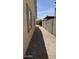 Narrow side yard with gravel for landscaping at 12505 W Adams St, Avondale, AZ 85323