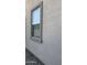 Window with screen, textured frame and gravel landscaping at 12505 W Adams St, Avondale, AZ 85323