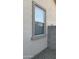 Exterior view features a window design with screen and landscaping detail at 12505 W Adams St, Avondale, AZ 85323