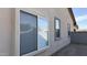 Exterior view showing window design with screens, stucco, and rock landscaping at 12505 W Adams St, Avondale, AZ 85323