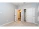 Open bedroom layout with closet, carpet, and views through to other rooms and hallways at 12547 W Stella Ln, Litchfield Park, AZ 85340